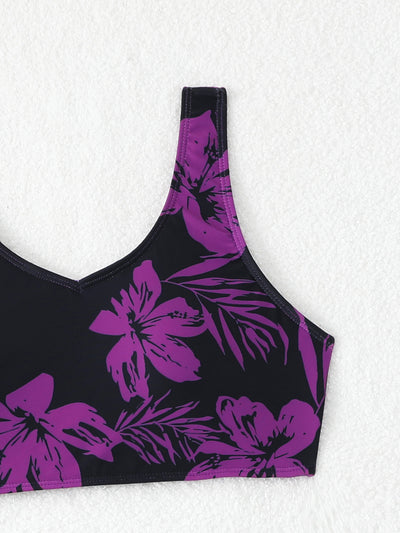 Women's two-piece swimsuit with black and purple floral print. Features a V-neck sports bra top and mid-rise bottom. - Image 37
