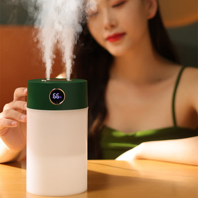 White cylindrical humidifier with a gold nozzle emitting mist, featuring a subtle bear emblem. Includes five aromatherapy oil bottles. - Image 3