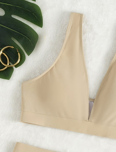 Women's deep-V Halong Bay-style two-piece swimsuit in light beige, featuring a crop top and high-waisted shorts. - Image 12