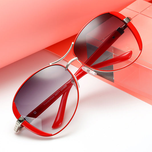 Women's large frame fashionable sunglasses with gradient gray lenses, silver-tone metal frames, and white arms.