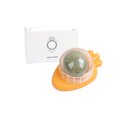 Orange carrot-shaped cat toy with a clear dome holding a rotating catnip ball, next to its white packaging box. - Image 18