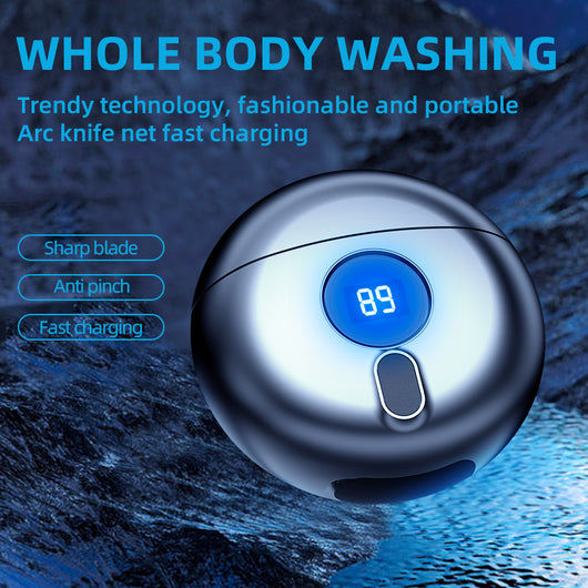 Dark gray mini electric razor with a circular design, featuring a small black display window and a silver trim.