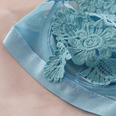Light blue lace lingerie set with floral details, including a bra, thong, garter belt, choker, and leg chains. - Image 7