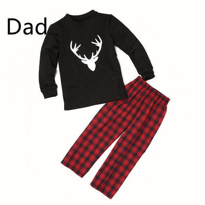 Mom's black long-sleeve pajama top with white deer head print and red and black plaid pajama pants. - Image 8