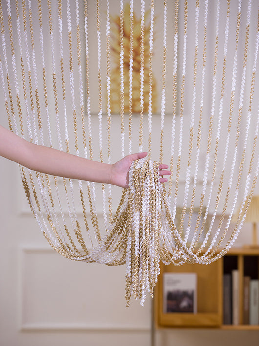 Brown and beige striped string curtain with twisted tassel texture, held by a hand, for living room partition. - Image 19
