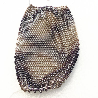 Close-up of a blue mesh fabric adorned with numerous small, clear rhinestones, creating a sparkling texture. - Image 64