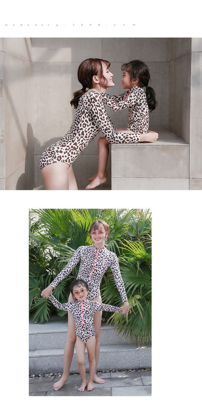 Child's long-sleeve leopard print swimsuit with a coral zipper and a matching swim cap on a white background. - Image 9