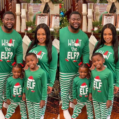 Family of four wearing matching green long-sleeve Christmas pajamas with "ELF" and striped pants.
