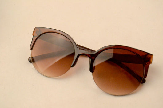 Half frame cat eye retro sunglasses with brown gradient lenses and a tortoiseshell-patterned frame. - Image 8