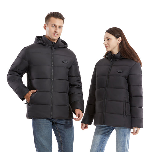Man and woman modeling black smart heating puffer jackets with hoods, zippered pockets, and horizontal quilting.