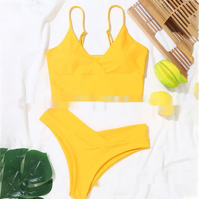 Bright yellow two-piece bikini swimsuit with a crop top and high-cut V-front bottoms, laid flat. - Image 19