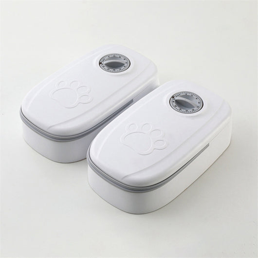 White automatic pet feeder with a pink timer dial and an embossed paw print on the lid. - Image 22
