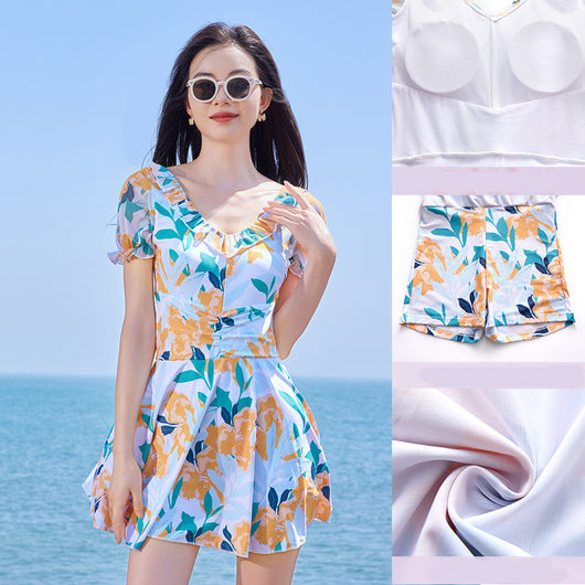White floral high waist swimsuit dress with orange, teal, and navy flowers, ruffled scoop neck, and puff sleeves. - Image 8
