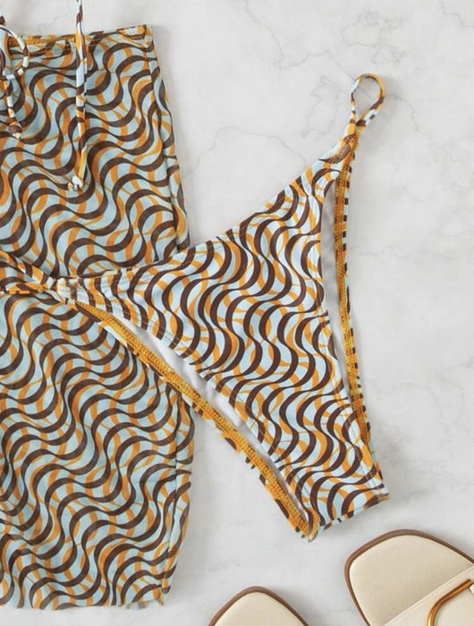 Three-piece swimsuit set with a wavy brown, blue, and white pattern, including a bikini top, mini skirt, and headscarf. - Image 16