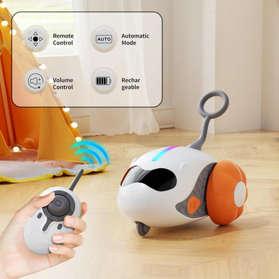 Interactive cat toy with white robotic base, orange wheels, and feather attachment, controlled by a remote, with a cat looking on. - Image 9