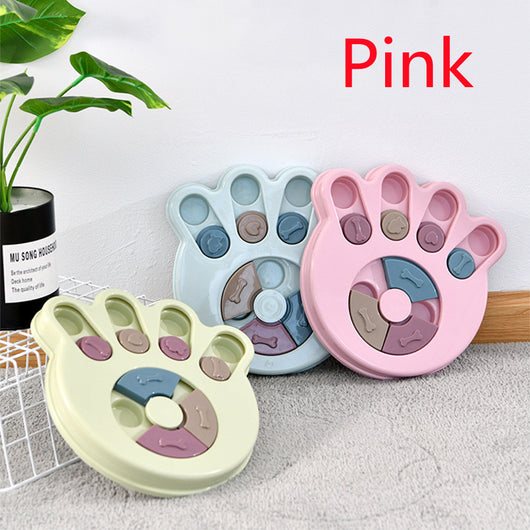 Paw-shaped dog puzzle feeder toy in light yellow with colorful sliding covers, filled with kibble. - Image 15