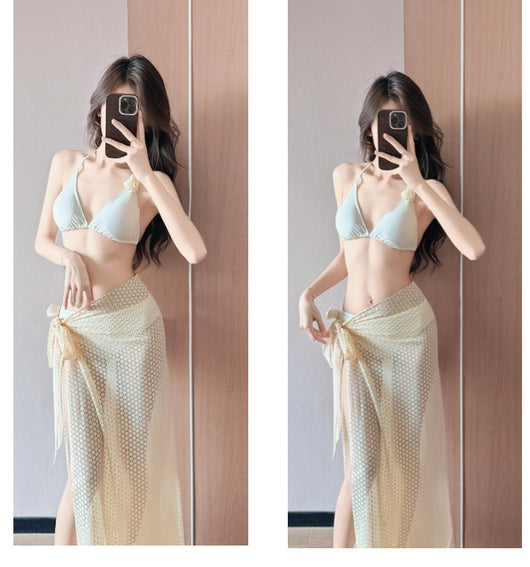 Women's light purple three-piece bikini set with a triangle halter top, bottoms, and a mesh sarong with rose details. - Image 17