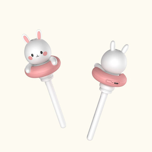 Two white and pink rabbit-shaped mini portable humidifiers, one facing forward and one showing the USB port. - Image 7