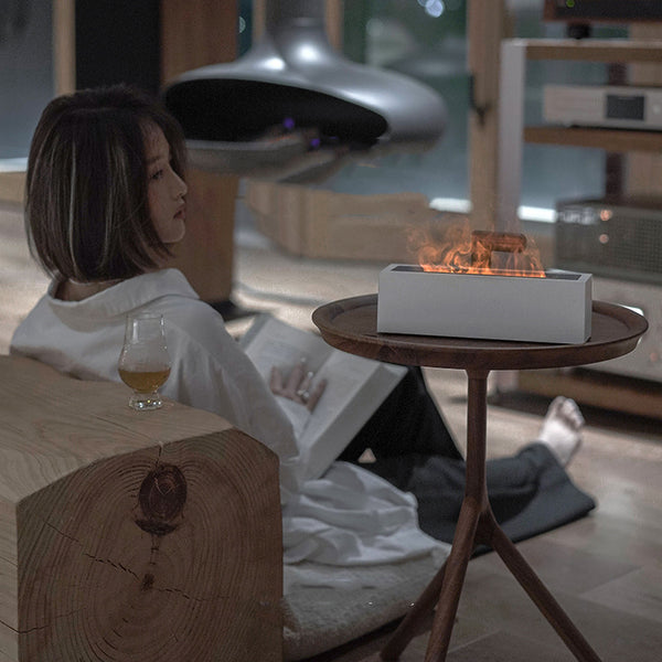 White rectangular aromatherapy machine with a flame effect, displaying the brand name "nathome".