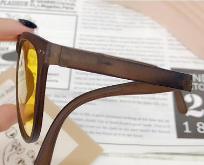 Light brown foldable women's sunglasses with round frames and brown polarized lenses on a white background. - Image 18
