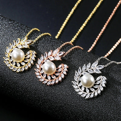 Elegant pearl and cubic zirconia jewelry set with a necklace and two earrings, featuring a wreath design. - Image 13
