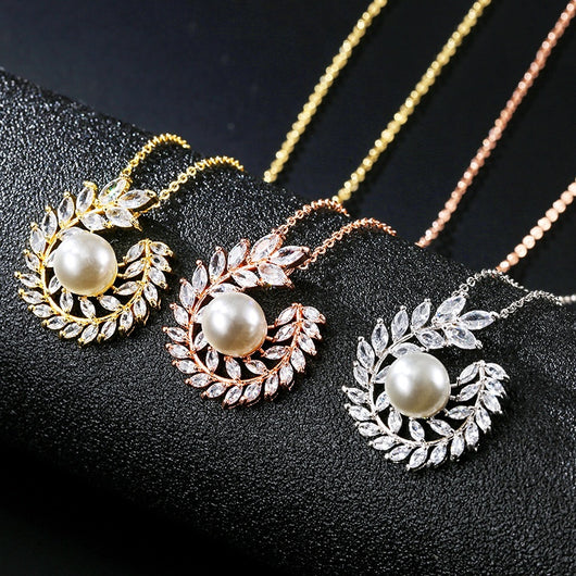 Elegant pearl and cubic zirconia jewelry set with a necklace and two earrings, featuring a wreath design. - Image 13