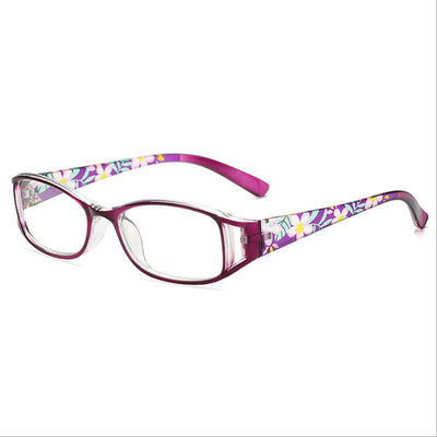 Women's lightweight fashion reading glasses with a red frame and colorful floral print temples. - Image 3