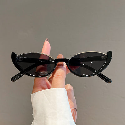 Pink cat-eye sunglasses with purple gradient lenses on a white background, showcasing a trendy style. - Image 6