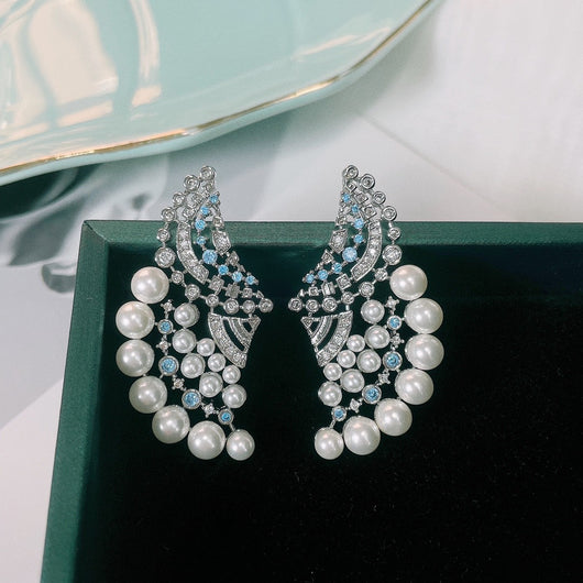 Aretes de Perla Elegantes con Zirconia y Diseño Ondulado - Image 10