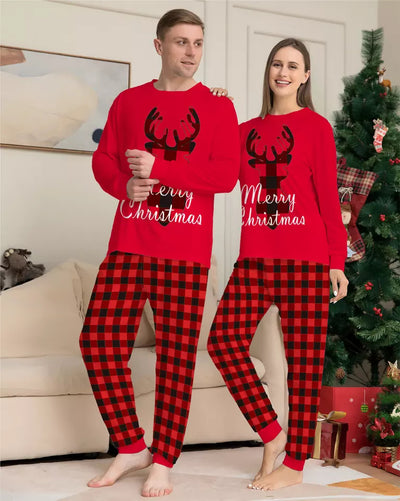 Family of four wearing matching red and black buffalo plaid Christmas pajamas with reindeer and "Merry Christmas" text. - Image 3