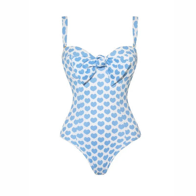 White shorts with blue heart print and ruffled sides, perfect for a fun vacation or casual summer day. - Image 9