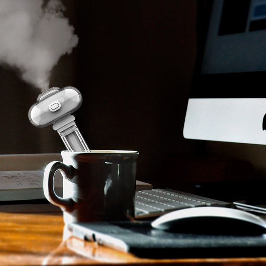 White and clear USB portable desktop humidifier with a small night light, featuring a compact design. - Image 9