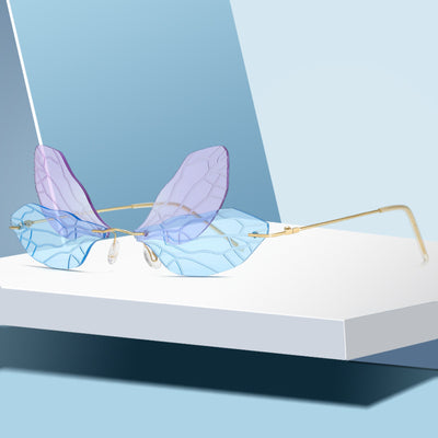 Light green rimless butterfly sunglasses with gold metal frames, featuring a unique veined lens design. - Image 13