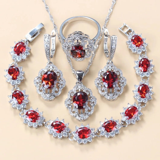Four-piece jewelry set with silver-tone settings, featuring oval purple cubic zirconia stones surrounded by clear accents. - Image 16