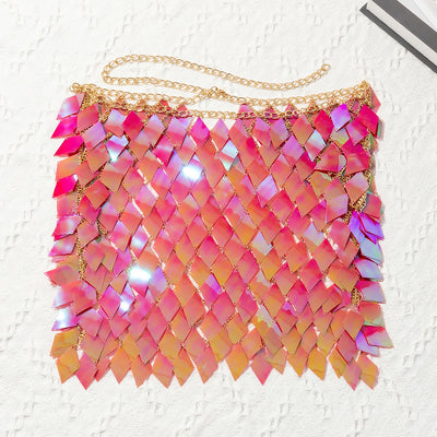 Woman wearing a gold-tone body chain top with iridescent pink and orange diamond-shaped sequins, perfect for beach or festival. - Image 24