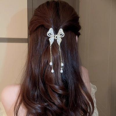 Horquilla de Perla Dorada con Borla Elegante