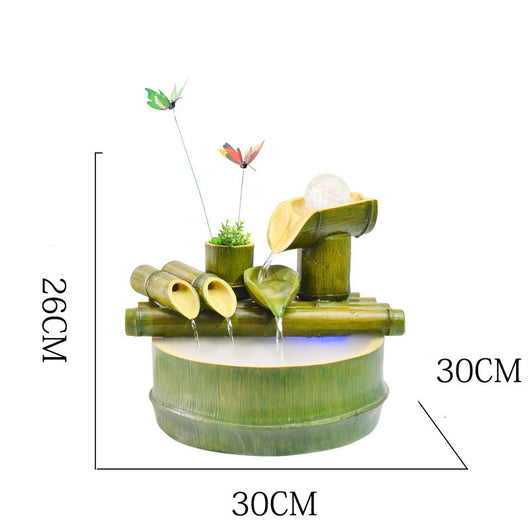 Green bamboo-themed indoor water fountain with multiple tiers, a water wheel, and small frog and butterfly accents. - Image 12