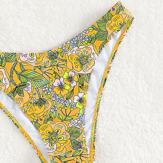 New printed bikini swimsuit with a vibrant floral pattern on a light blue background, featuring a scoop neck top and high-cut bottom. - Image 5