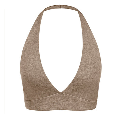 Light pink halter neck sports bra and high-waisted leggings workout set on a model. - Image 36