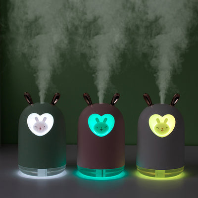 White rabbit humidifier with rose gold ears, a heart-shaped cutout, and a smiling bunny figure inside. - Image 12