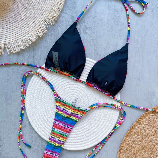Women's multicolor letter printed lace-up bikini suit with triangle top and thong bottom, displayed on a white mat. - Image 2