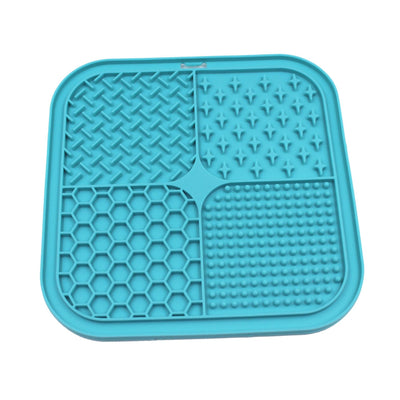 Gray silicone pet licking pad with four textured sections, designed for slow feeding and anti-choking. - Image 32