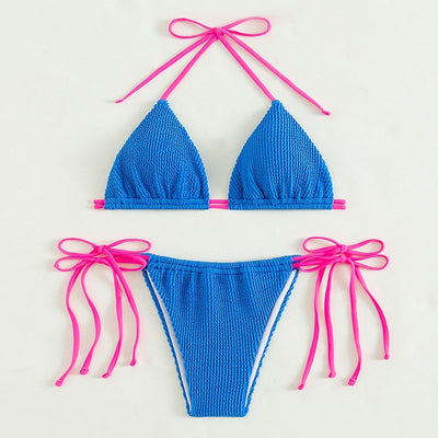 Women's purple textured two-piece swimsuit with light blue lace-up ties, featuring a triangle bikini top and thong bottom. - Image 15