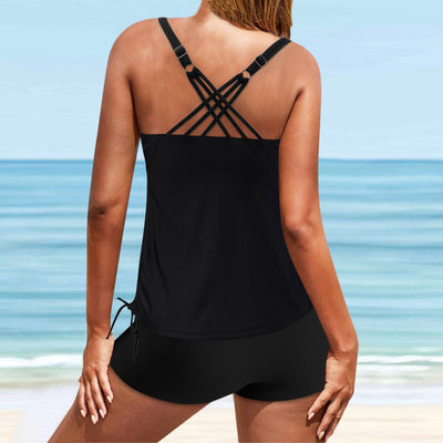 Fuchsia pink tankini swimsuit for women featuring a pleated halter top and matching swim shorts, modeled on a beach. - Image 16
