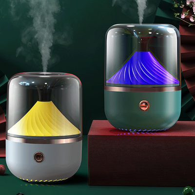 Dark green aromatherapy machine with a transparent top, yellow spiral diffuser, and copper trim. - Image 7