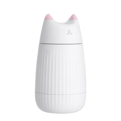 Pink cat-shaped humidifier with pointed ears and a ribbed texture on the lower body, ideal for desktop use. - Image 10