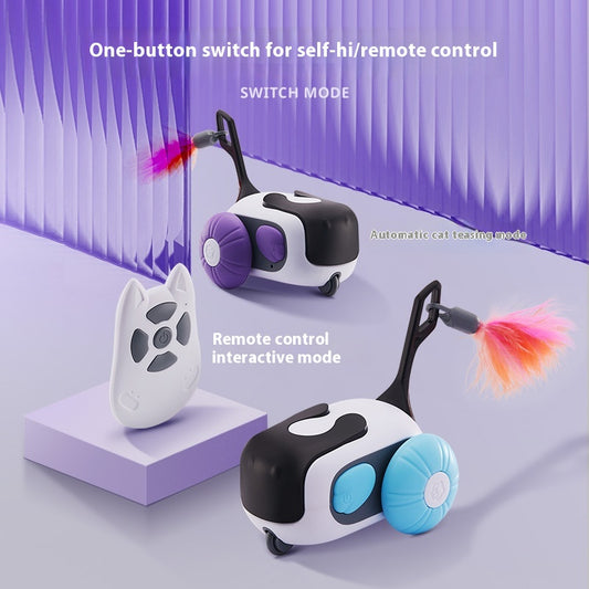 White and black remote control cat toy car with purple wheels and an orange feather, next to a white cat-shaped remote. - Image 2