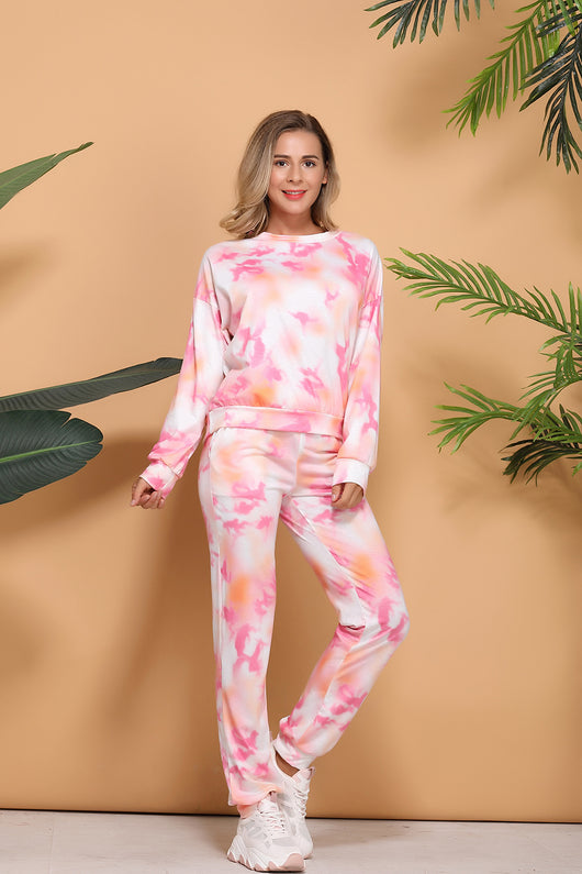 Woman wearing a pink and white tie-dye long-sleeve top and matching pants set, posing casually. - Image 15