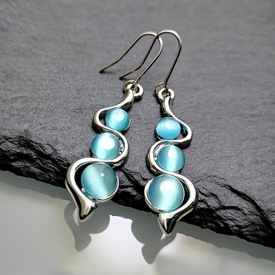 Aretes Ondulados Estilo Bohemio con Gema Ojo de Gato - Image 9