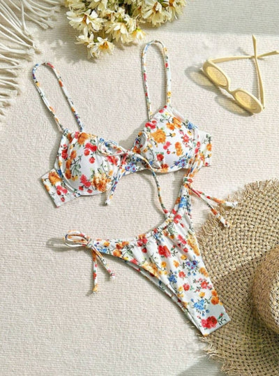 Women's white floral two-piece bikini with red, orange, and blue flowers, featuring a tie-front top and tie-side bottoms. - Image 9